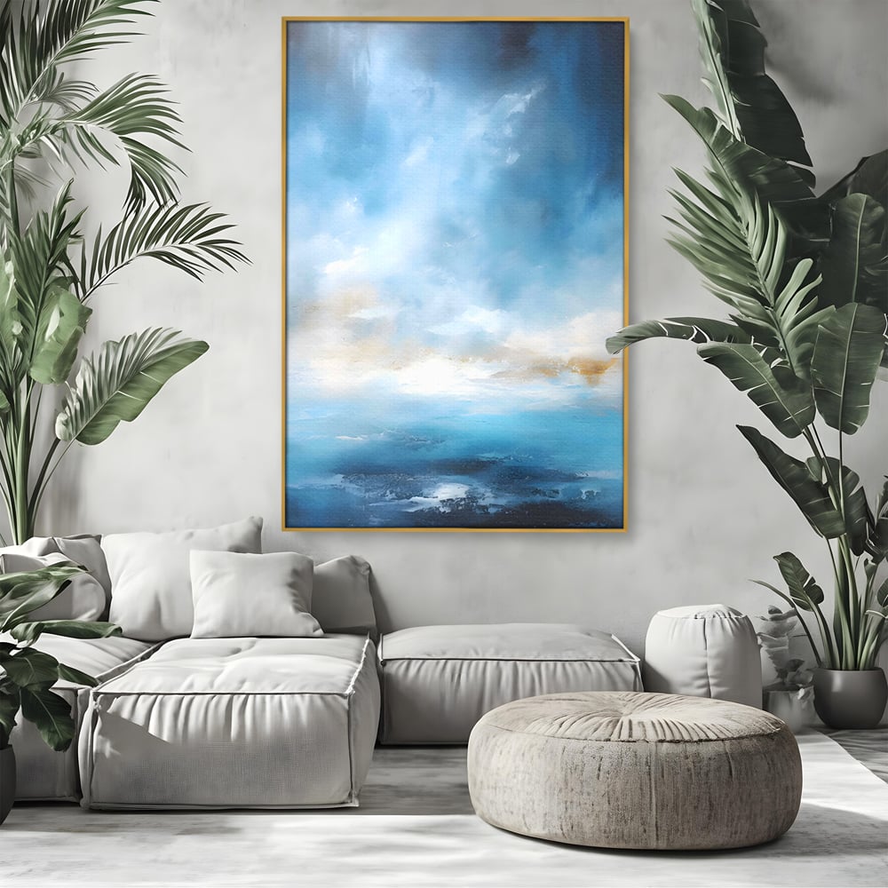 Tablou canvas cu tablou pictura abstracta cer si mare, in rama de aluminiu auriu, pe perete intr-un living